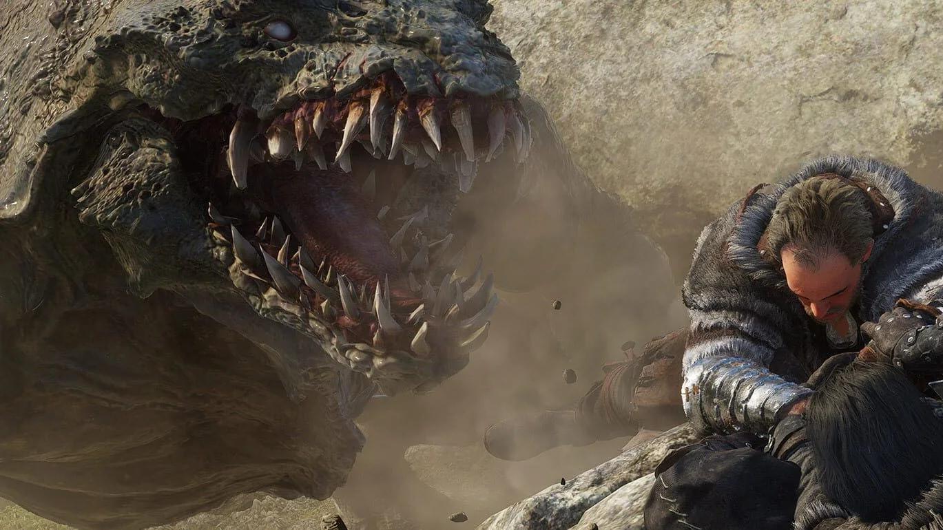 A heavily armored man in fur-lined clothing protects another person from a large, snarling monster with sharp teeth in a dusty landscape.