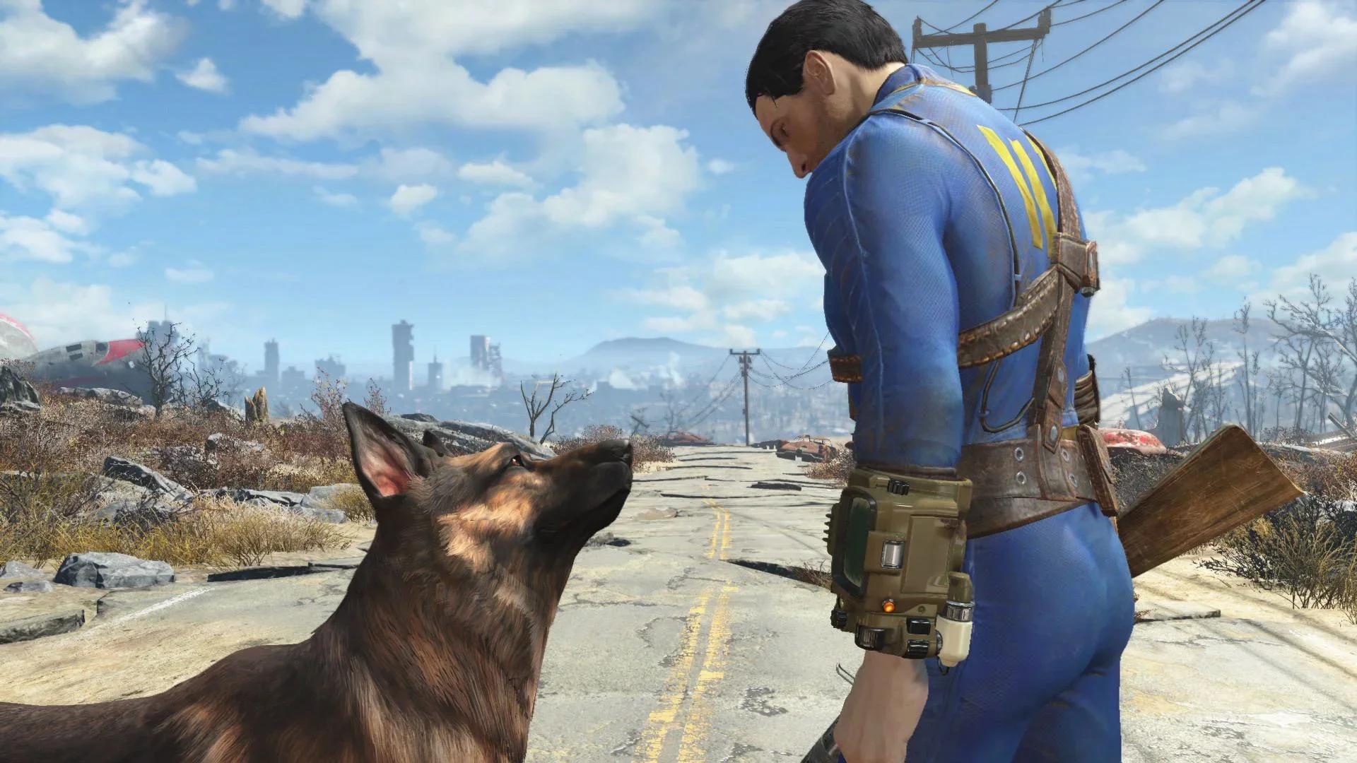 Fallout 4's Sole Survivor in a blue Vault 111 jumpsuit, standing on a cracked road in the ruined Commonwealth with Dogmeat