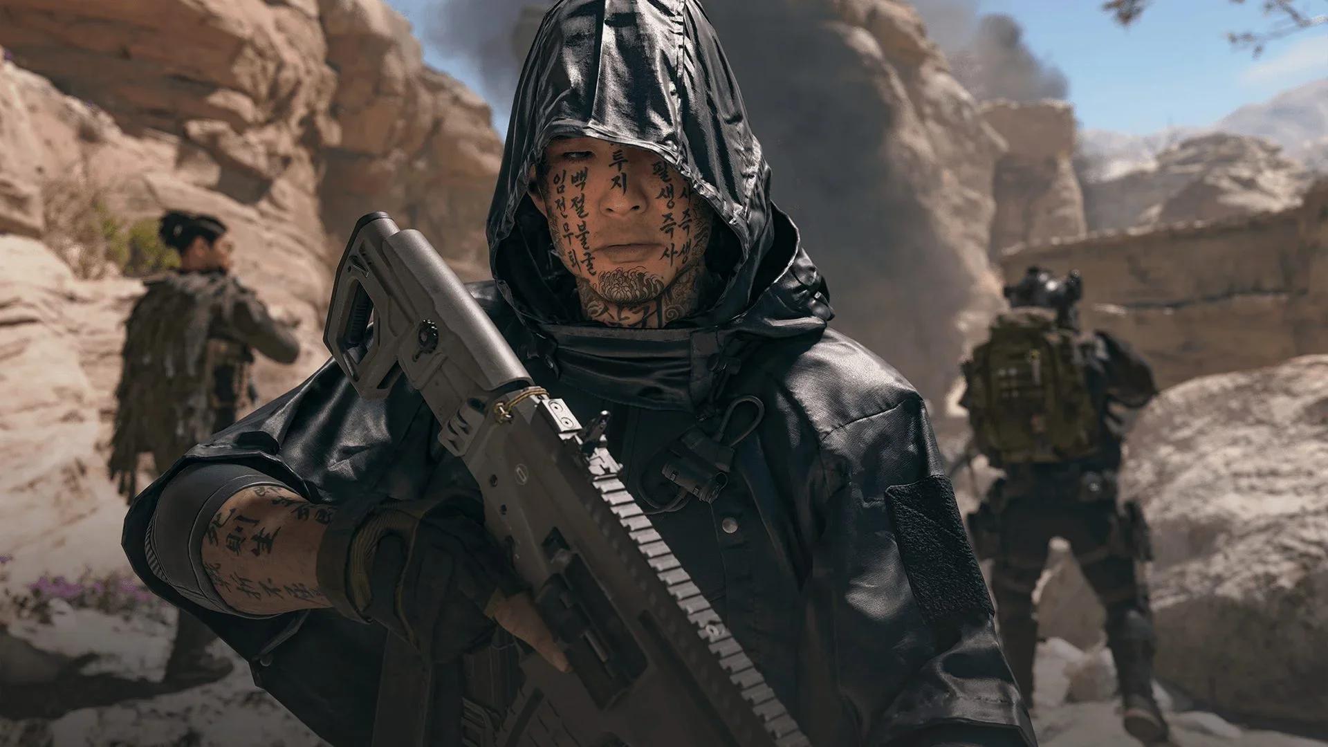 A hooded operator with script tattooed across his face holds a rifle in a rocky canyon, two squadmates behind him, in Modern Warfare 4 Season 1 key art.